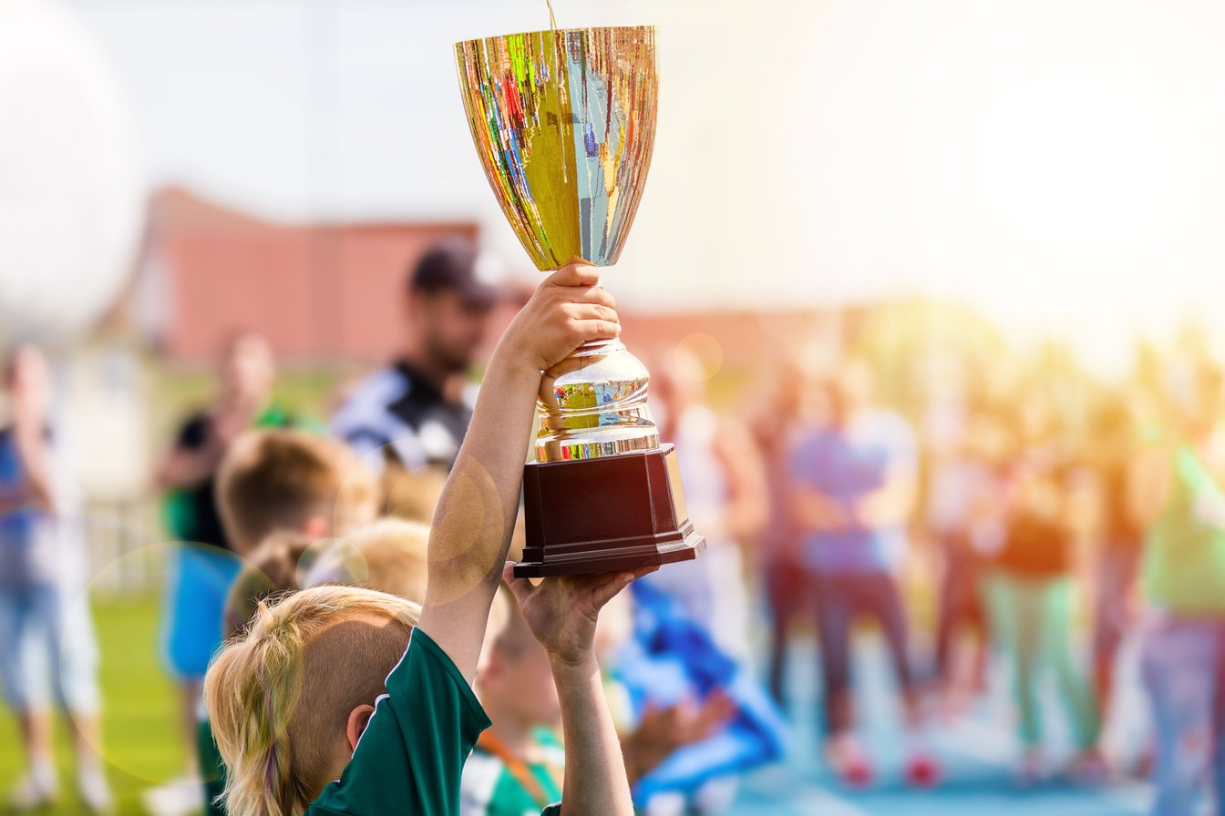 Young Athlete Holding Trophy